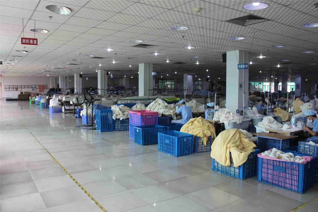 Wide view of the sewing floor inside the Aokuma Toy plush factory