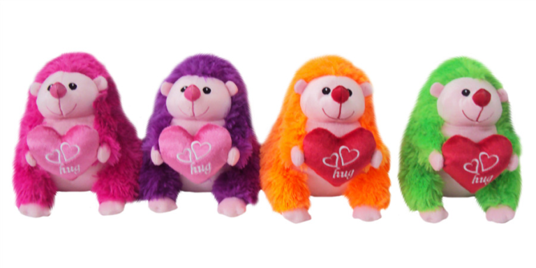 Four colourful plush hedgehogs holding heart pillows embroidered with the word hug