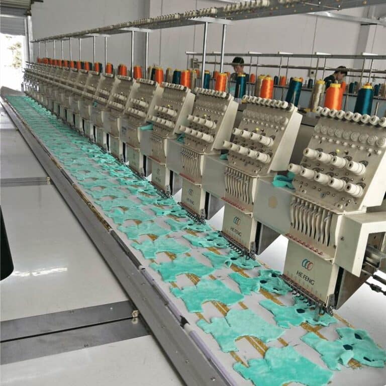 Multi-head computerised embroidery machine stitching plush fabric panels